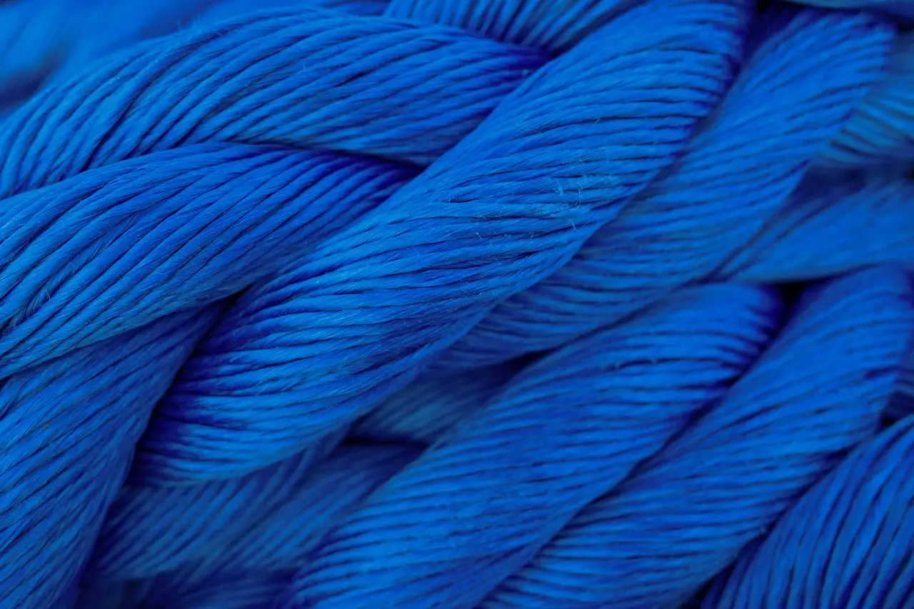 Detailed close-up of vibrant blue twisted cord showcasing texture.