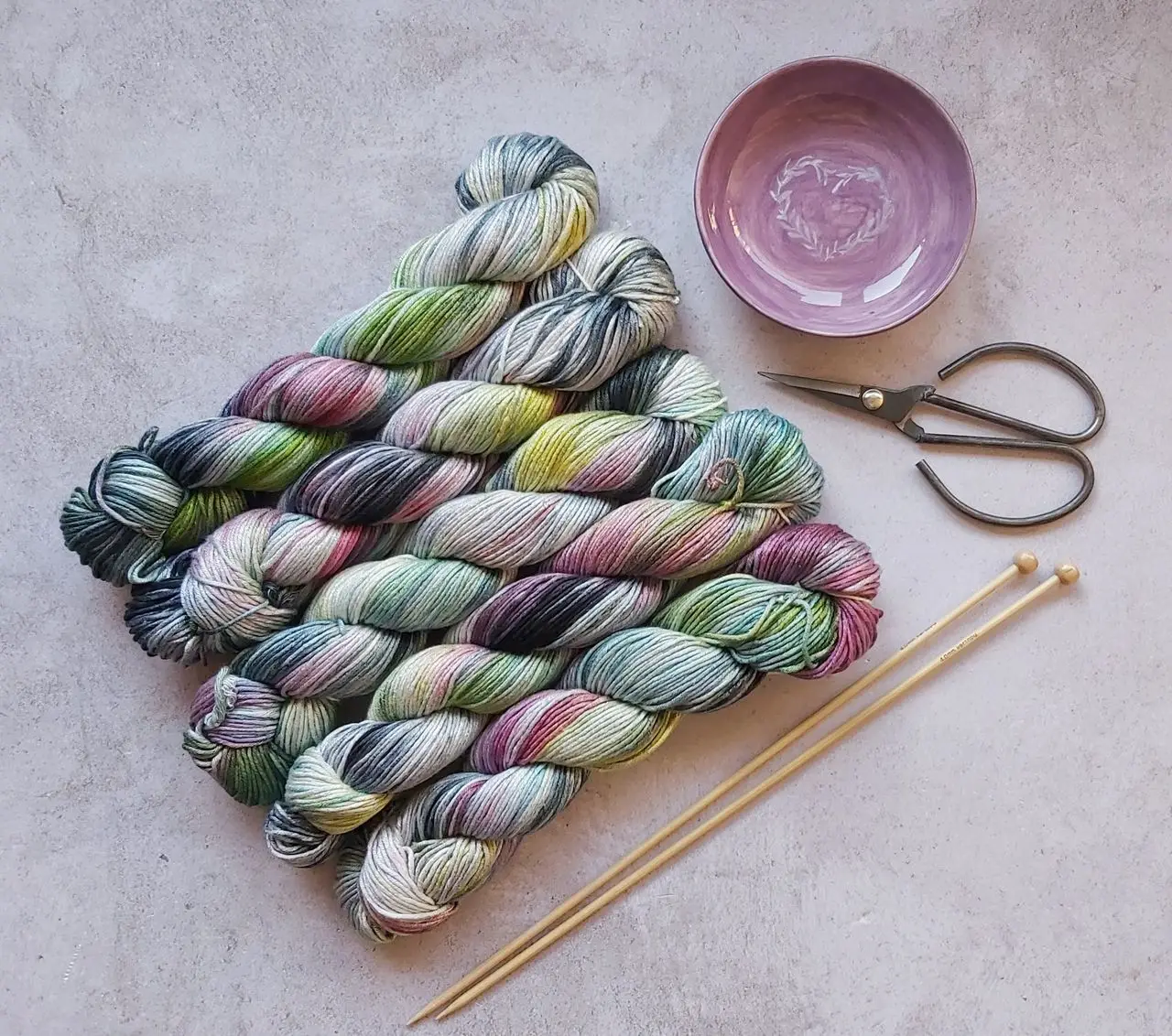 Crafting Captivating Headlines: Your awesome post title goes here Overhead shot of colorful yarn skeins, knitting needles, and scissors on a textured surface.